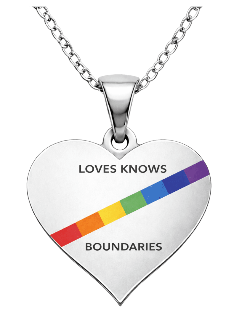 Heart-shaped pendant with a rainbow stripe and empowering message.